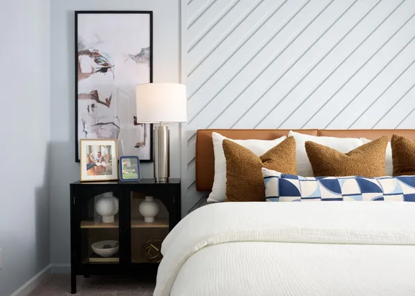 a bedroom with a bed and a table