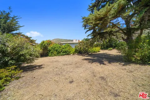 a view of a road with a yard