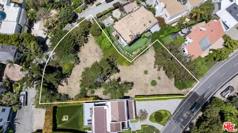 an aerial view of house with a yard