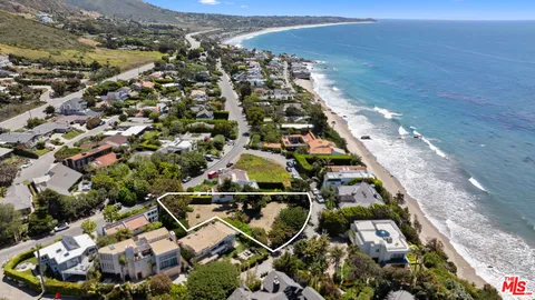 an aerial view of a house with a garden
