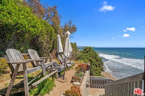 a view of a chairs and table on the terrace