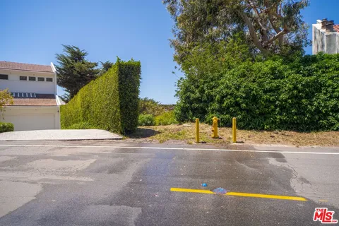 a view of a swimming pool and a yard