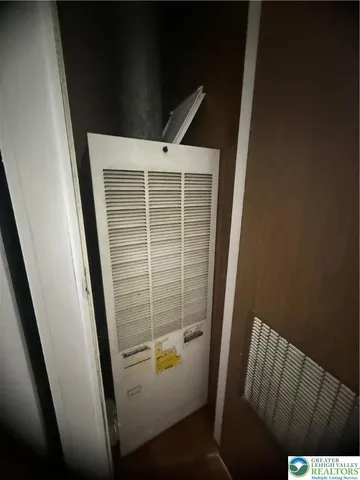 a view of a hallway with washer and dryer