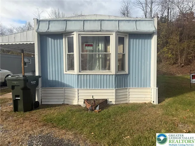 a front view of a house with a porch