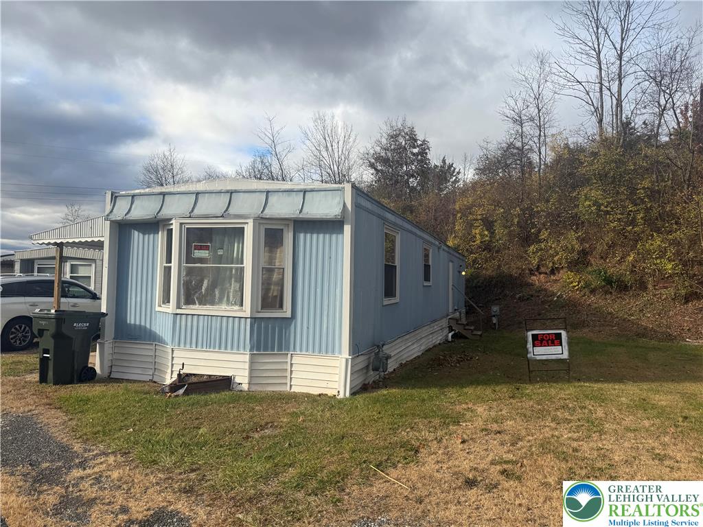 17 Bordic Road Reading, PA 19606 - Photo 3 of 19 a front view of a house with a yard