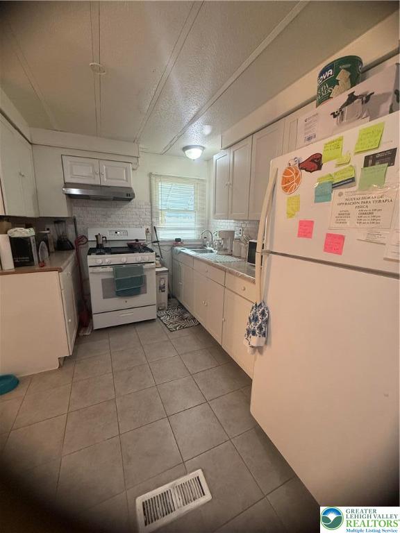17 Bordic Road Reading, PA 19606 - Photo 9 of 19 a kitchen with stainless steel appliances granite countertop a sink and refrigerator