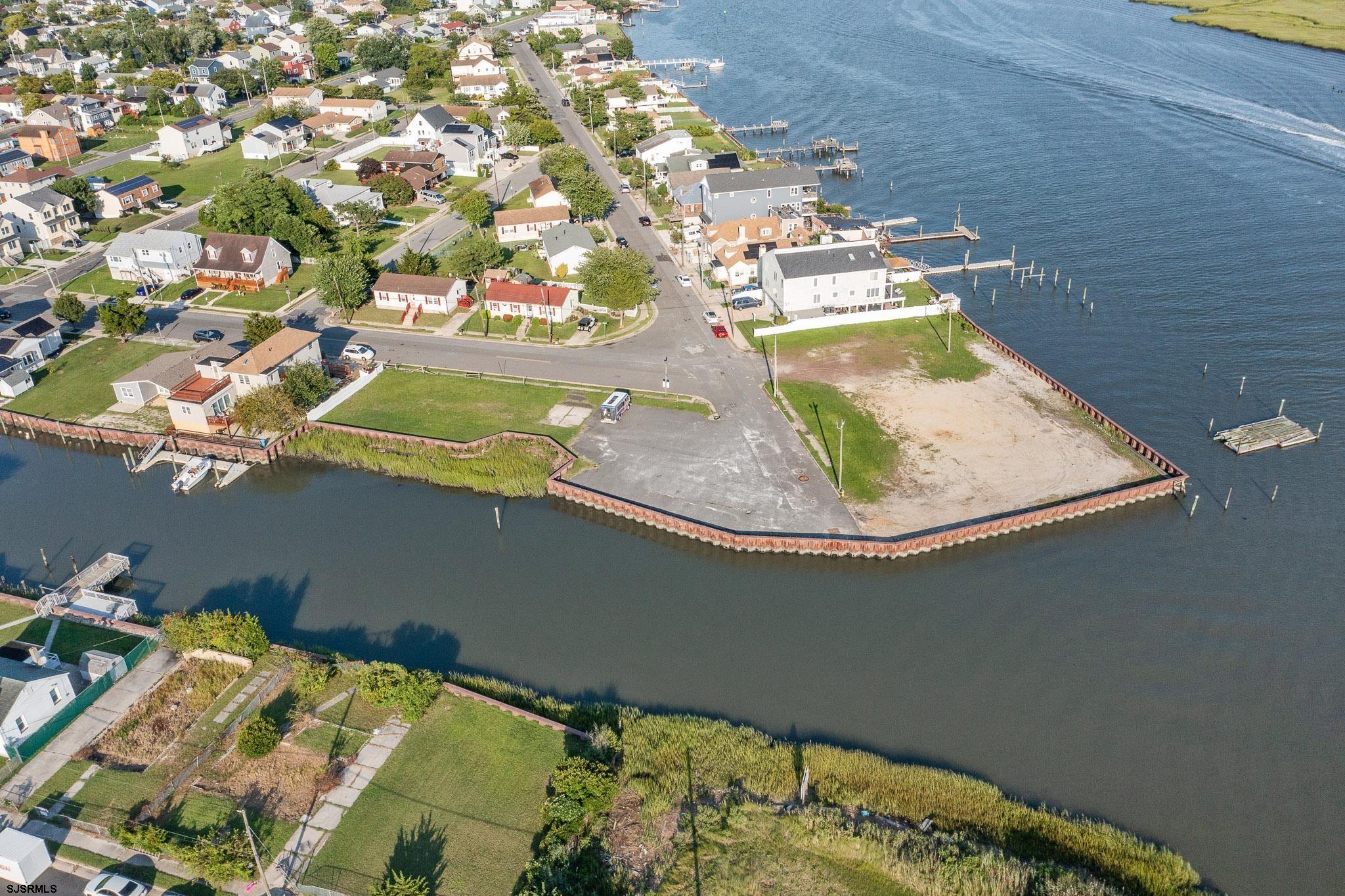 an aerial view of a house with a lake view