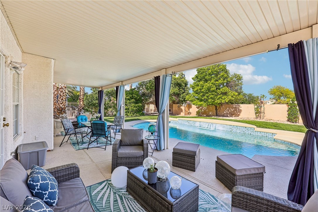 5236 Saranac Road Las Vegas, NV 89130 - Photo 46 of 52 This private outdoor living space features a covered patio perfect for relaxation and entertaining by the pool.