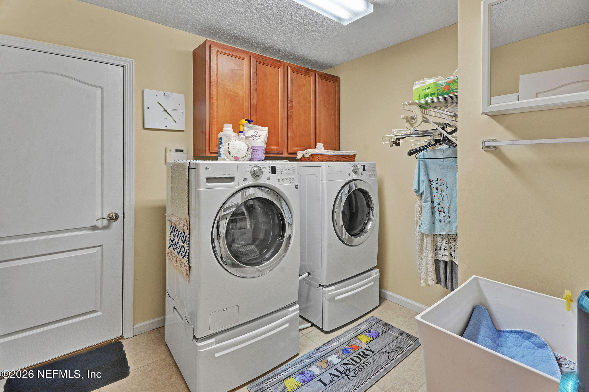 5950 West Shores Road Orange Park, FL 32003 - Photo 34 of 42 a utility room with dryer and washer