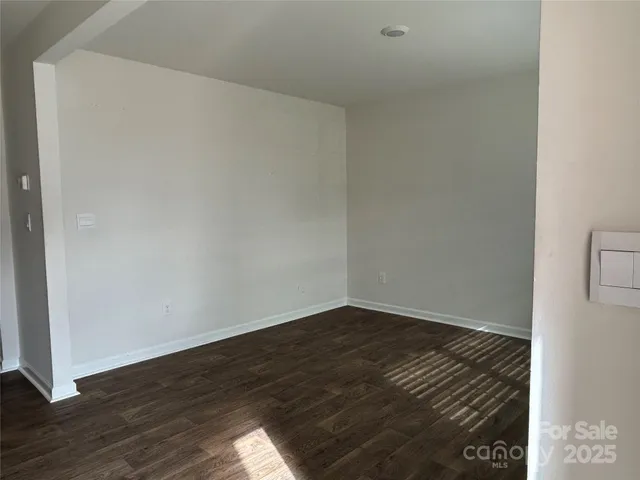 a kitchen with stainless steel appliances granite countertop a refrigerator stove a sink and a microwave