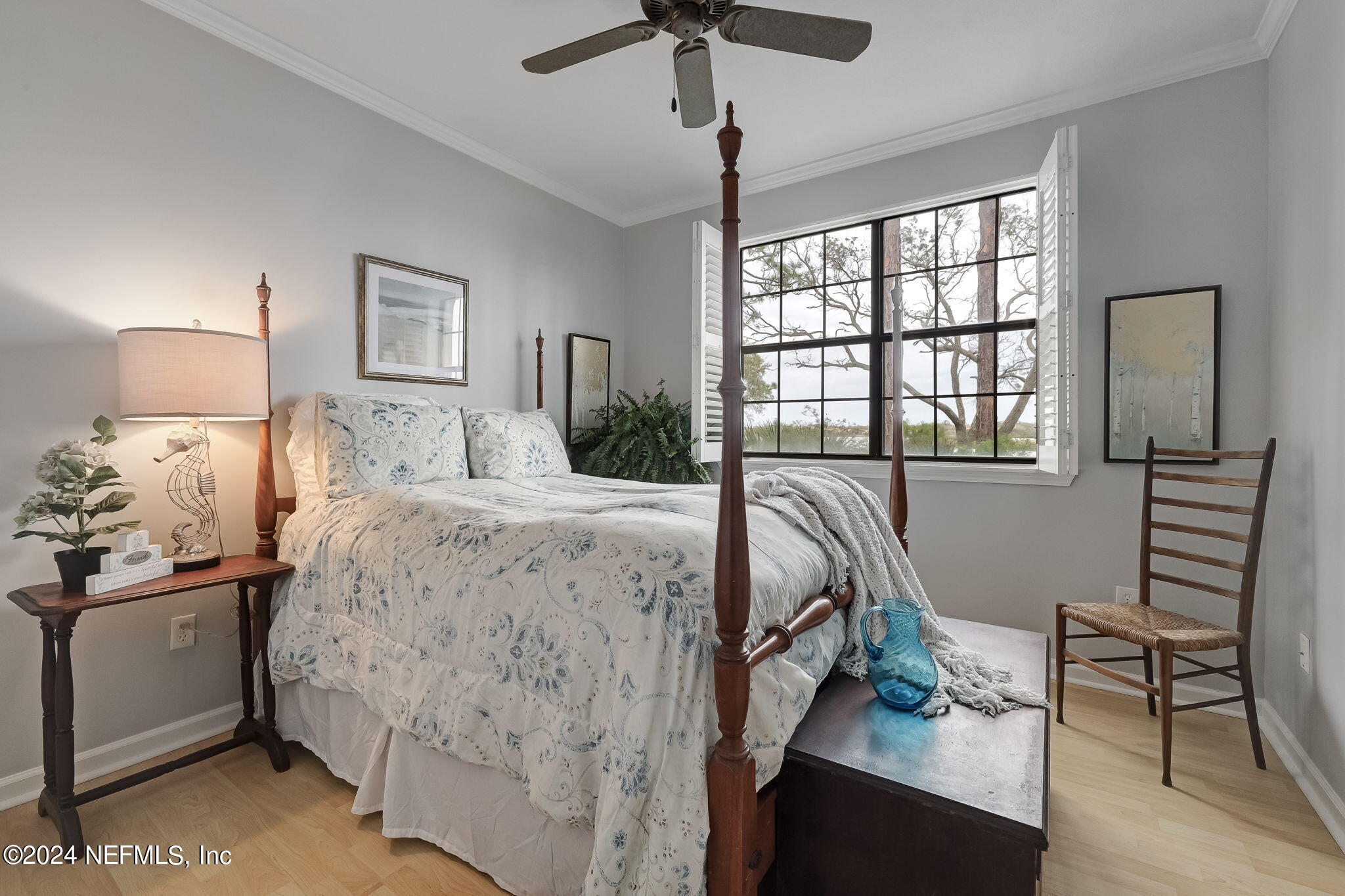 3302 Haley Pointe Road St. Augustine, FL 32084 - Photo 19 of 53 a bedroom with a bed and a chandelier