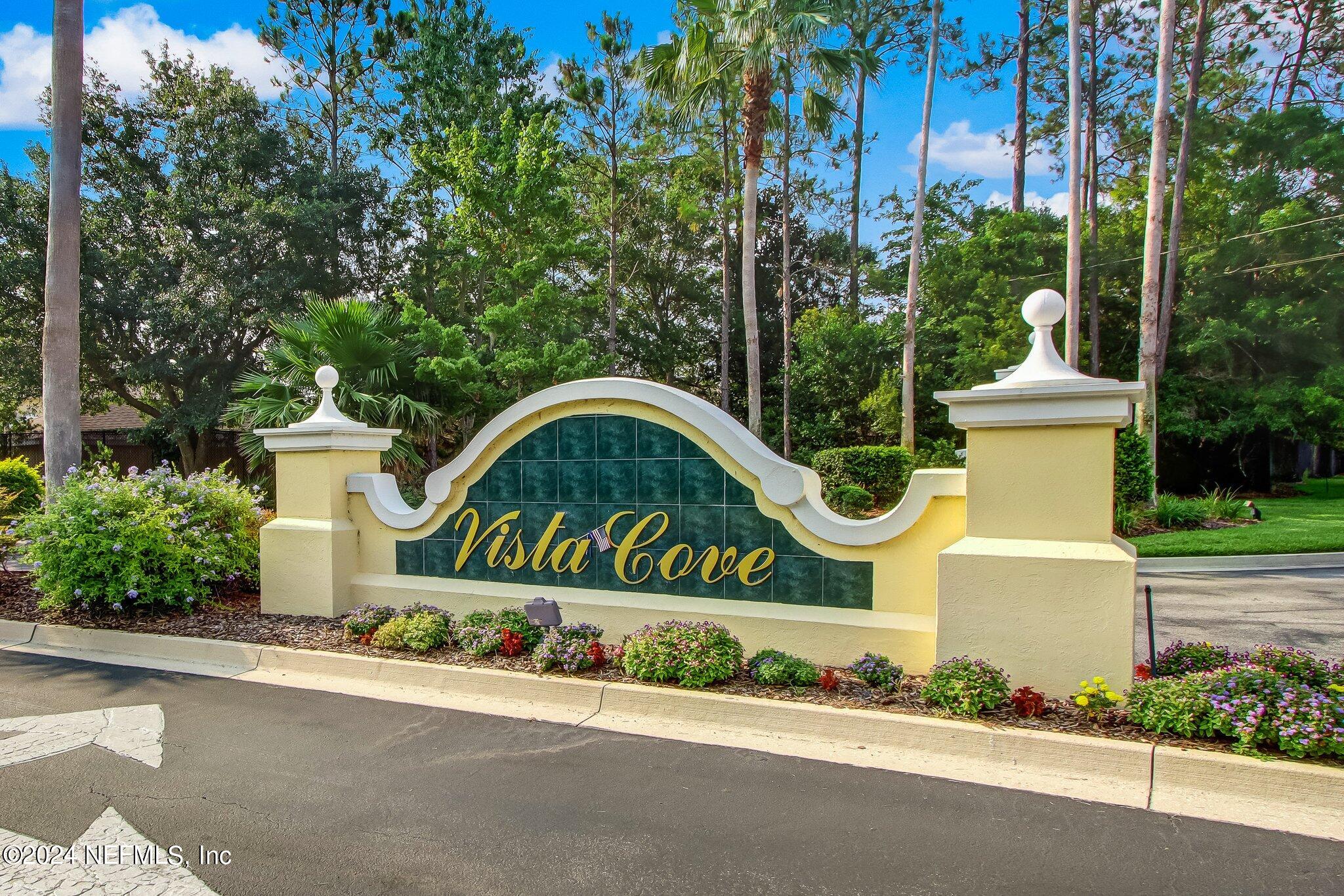 3302 Haley Pointe Road St. Augustine, FL 32084 - Photo 25 of 53 a front view of a house with a garden and signage