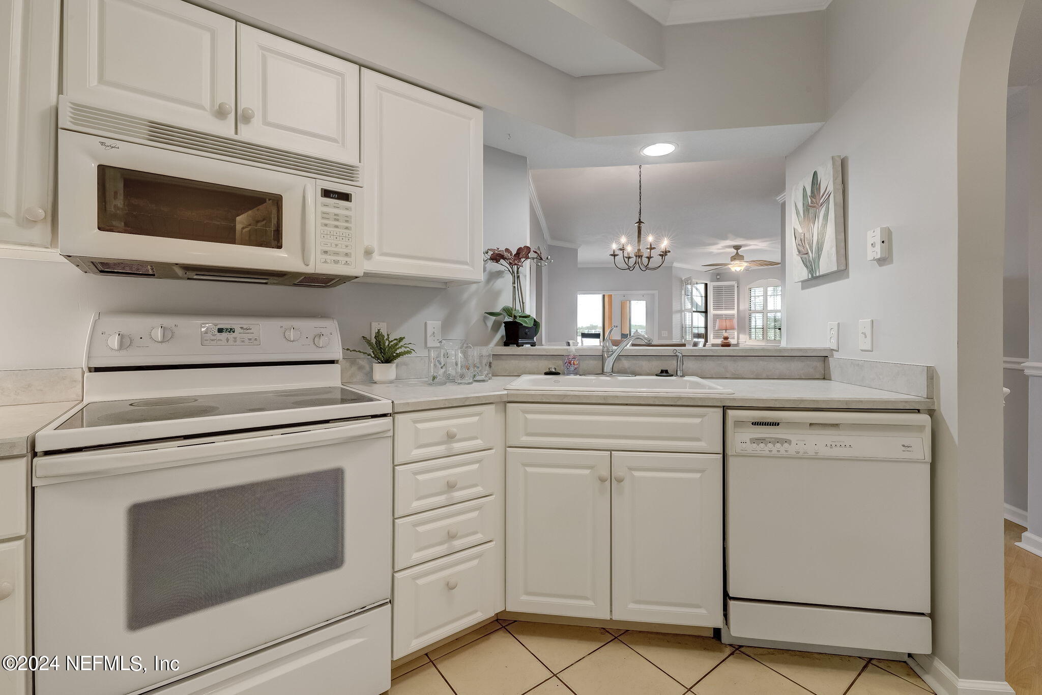 3302 Haley Pointe Road St. Augustine, FL 32084 - Photo 7 of 53 a kitchen with white cabinets stainless steel appliances and sink