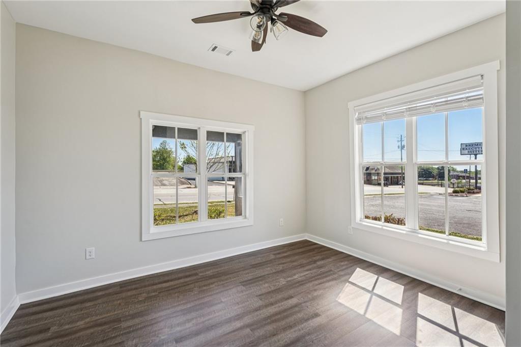 212 Hamilton Avenue Bremen, GA 30110 - Photo 36 of 65 a view of an empty room with a window and wooden floor