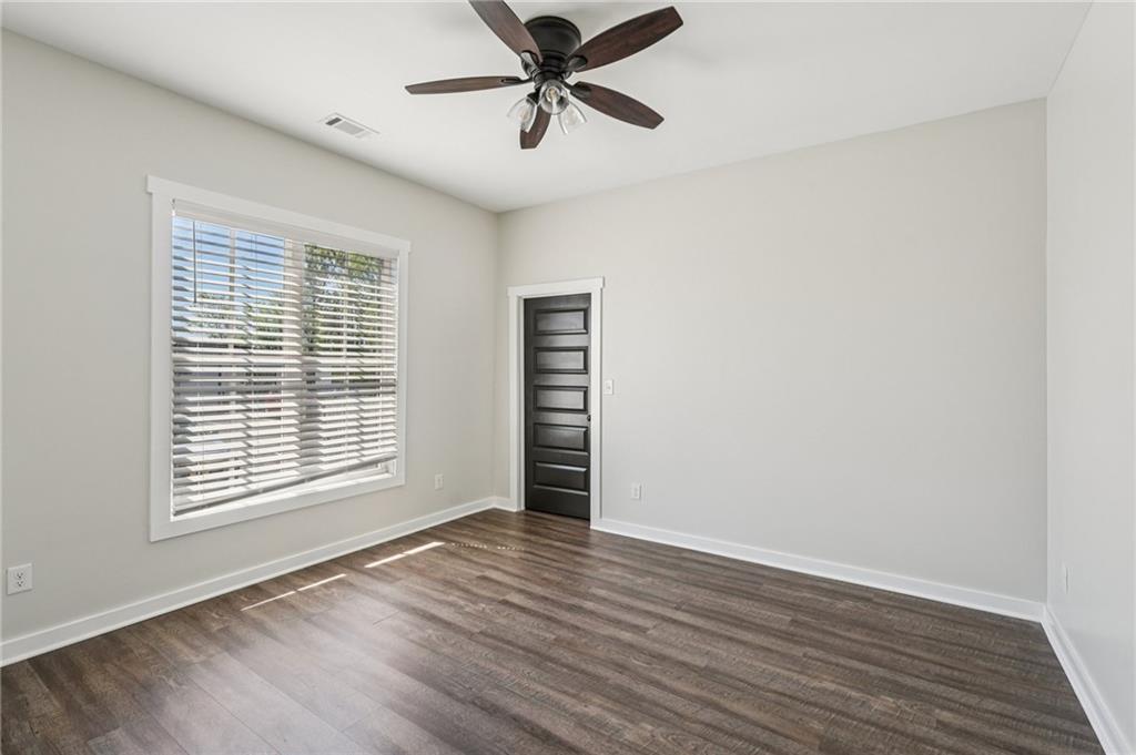 212 Hamilton Avenue Bremen, GA 30110 - Photo 41 of 65 wooden floor in an empty room with a window