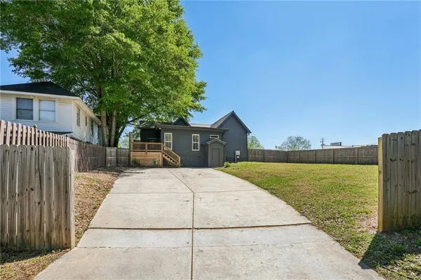 a front view of a house with swimming pool