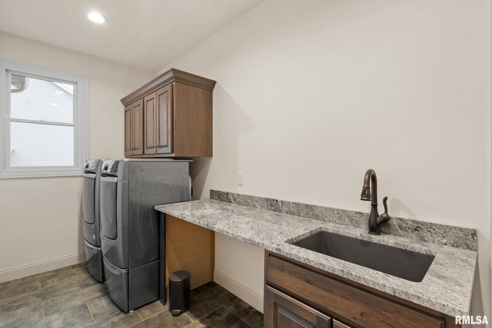 1422 Racine Court Davenport, IA 52804 - Photo 29 of 53 a kitchen with a sink and refrigerator