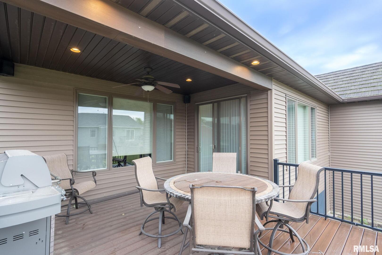 1422 Racine Court Davenport, IA 52804 - Photo 34 of 53 a balcony with table and chairs