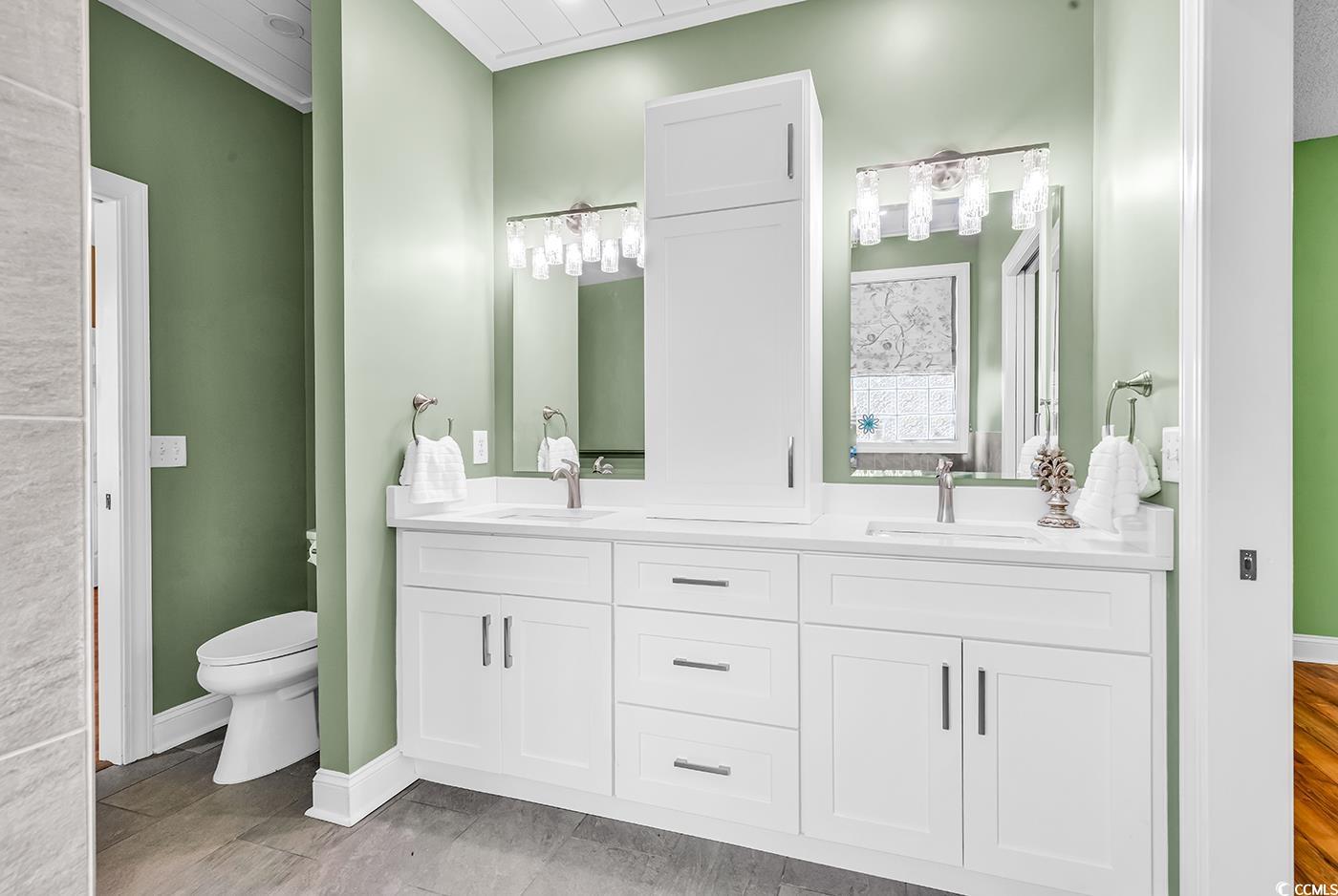 6161 Inman Circle Conway, SC 29526 - Photo 17 of 40 Full bath featuring double vanity, toilet, baseboa