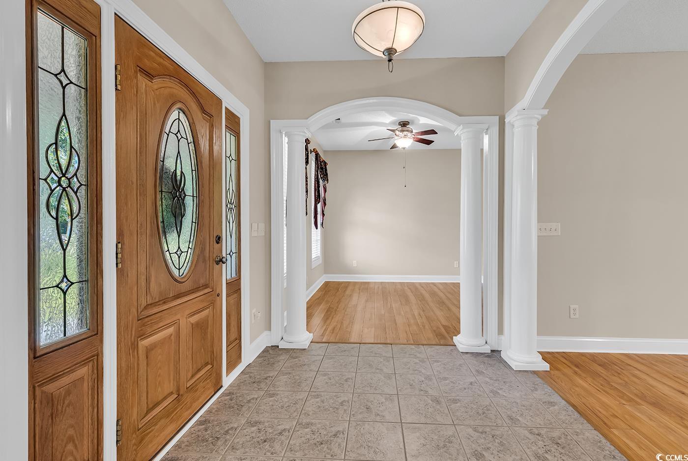 6161 Inman Circle Conway, SC 29526 - Photo 3 of 40 Foyer featuring decorative columns, arched walkway