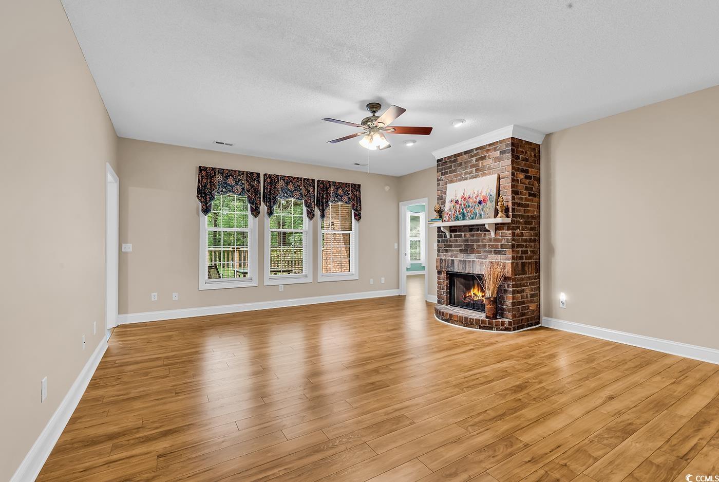 6161 Inman Circle Conway, SC 29526 - Photo 5 of 40 Unfurnished living room featuring ceiling fan, a b