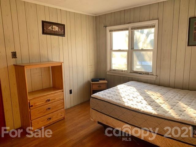 645 Thompson Cove Road Clyde, NC 28721 - Photo 8 of 12 a bedroom with a bed and a window