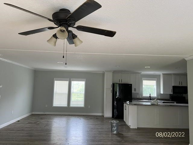 970 Wingo Levee Road Greenfield, TN 38230 - Photo 13 of 25 a view of a kitchen with a sink stainless steel appliances and cabinets