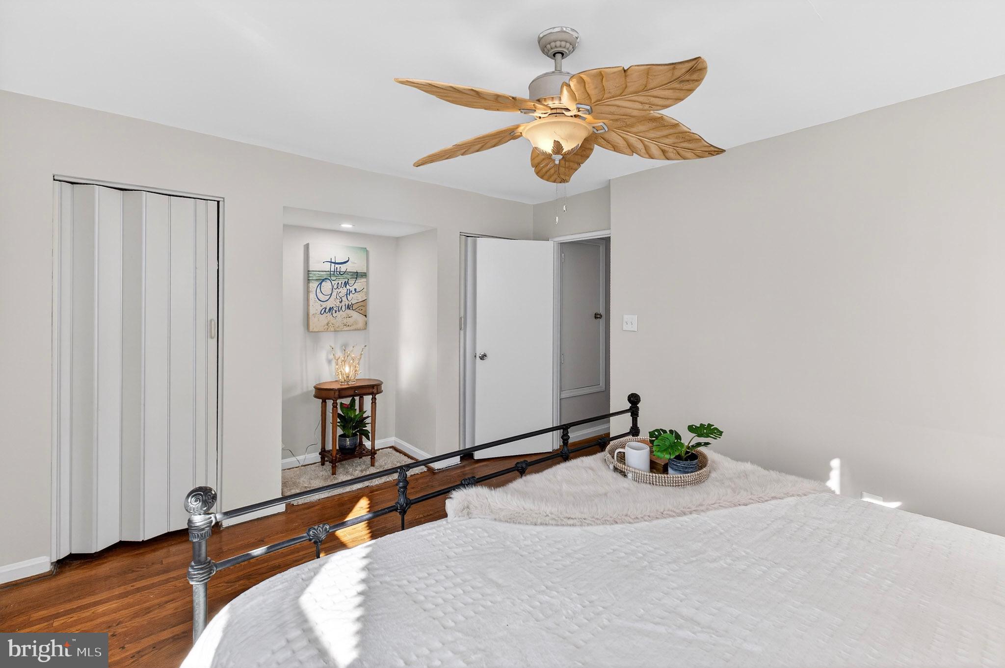 1112 Hamilton Street Northeast Washington, DC 20011 - Photo 27 of 34 a bedroom with a bed and a chandelier