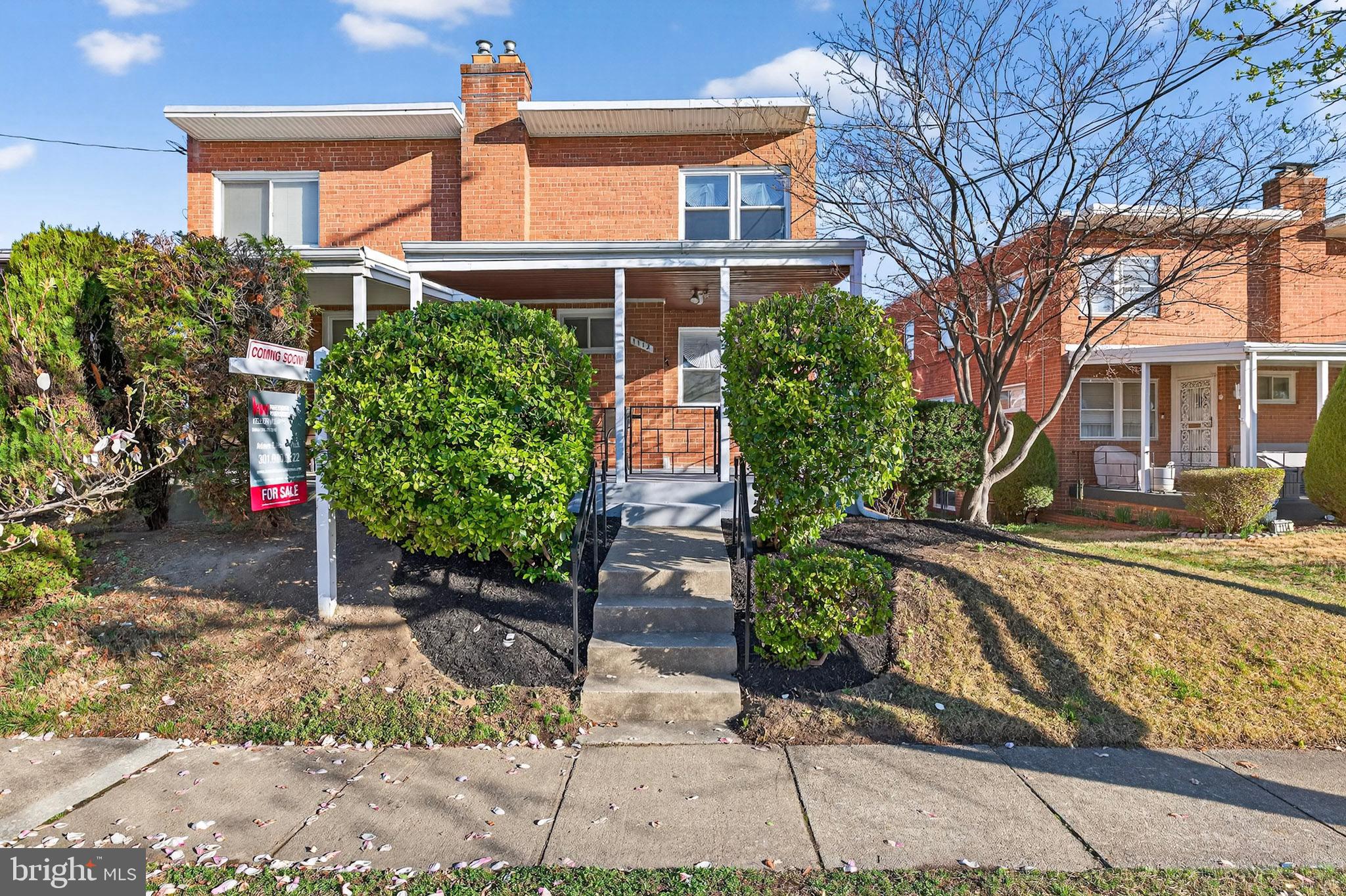 1112 Hamilton Street Northeast Washington, DC 20011 - Photo 3 of 34 a front view of a house with garden