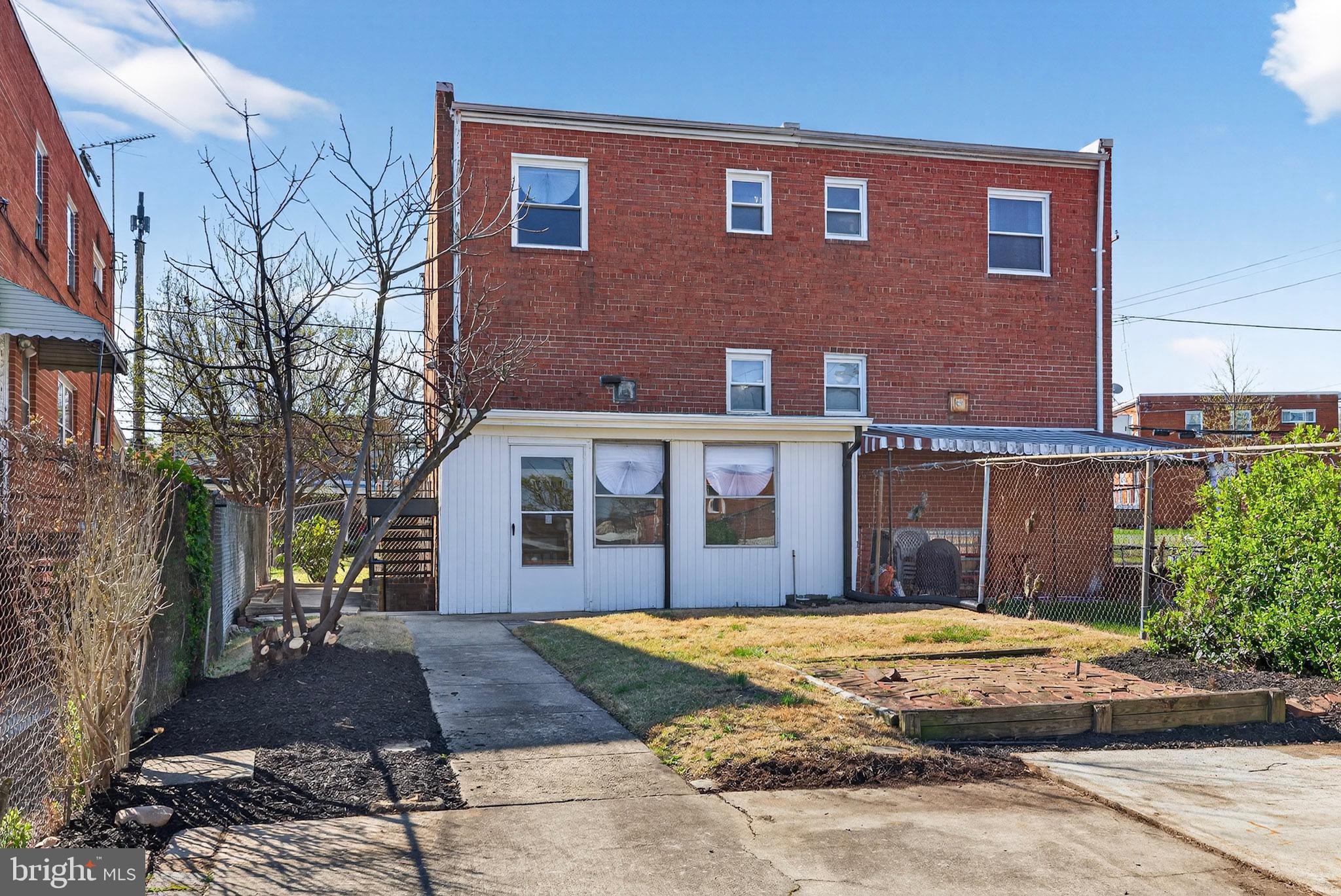 1112 Hamilton Street Northeast Washington, DC 20011 - Photo 34 of 34 a view of a brick house with a yard