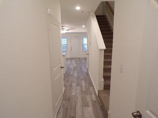 709 South 5th Street, Unit 2 Bonham, TX 75418 - Photo 24 of 32 a view of a hallway with wooden floor and staircase