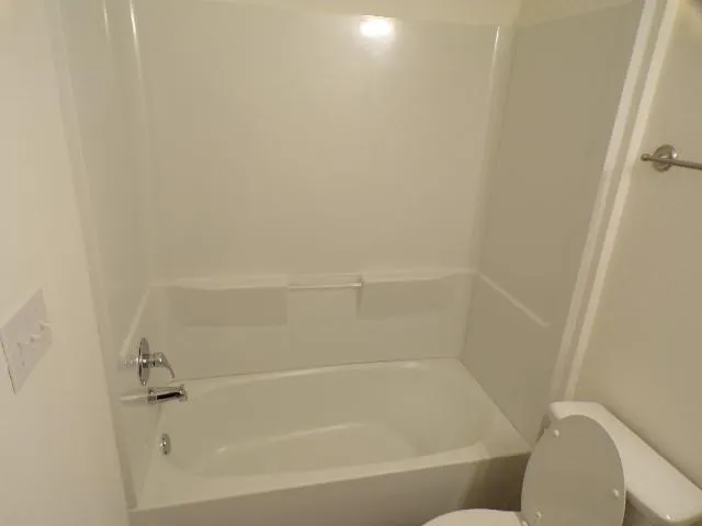 a close up of a bathtub in a bathroom