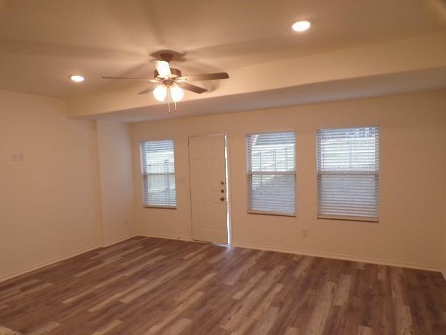 709 South 5th Street, Unit 2 Bonham, TX 75418 - Photo 10 of 32 a view of empty room with wooden floor and fan