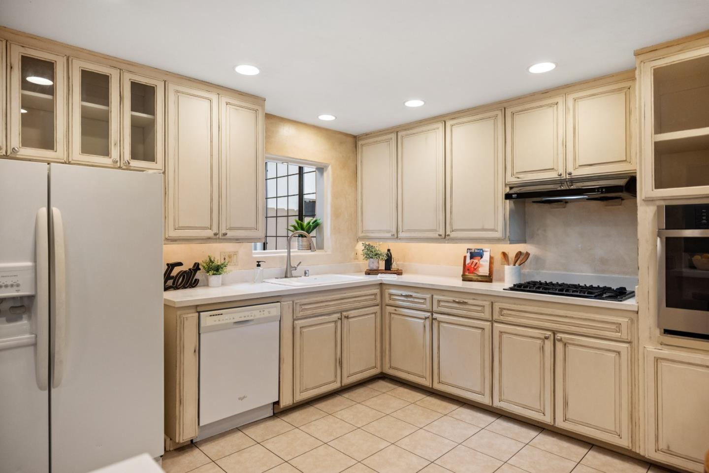 777 Parcel Street Monterey, CA 93940 - Photo 11 of 21 a kitchen with a sink window and cabinets