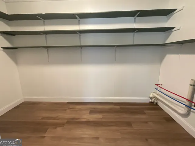 a view of kitchen with wooden floor