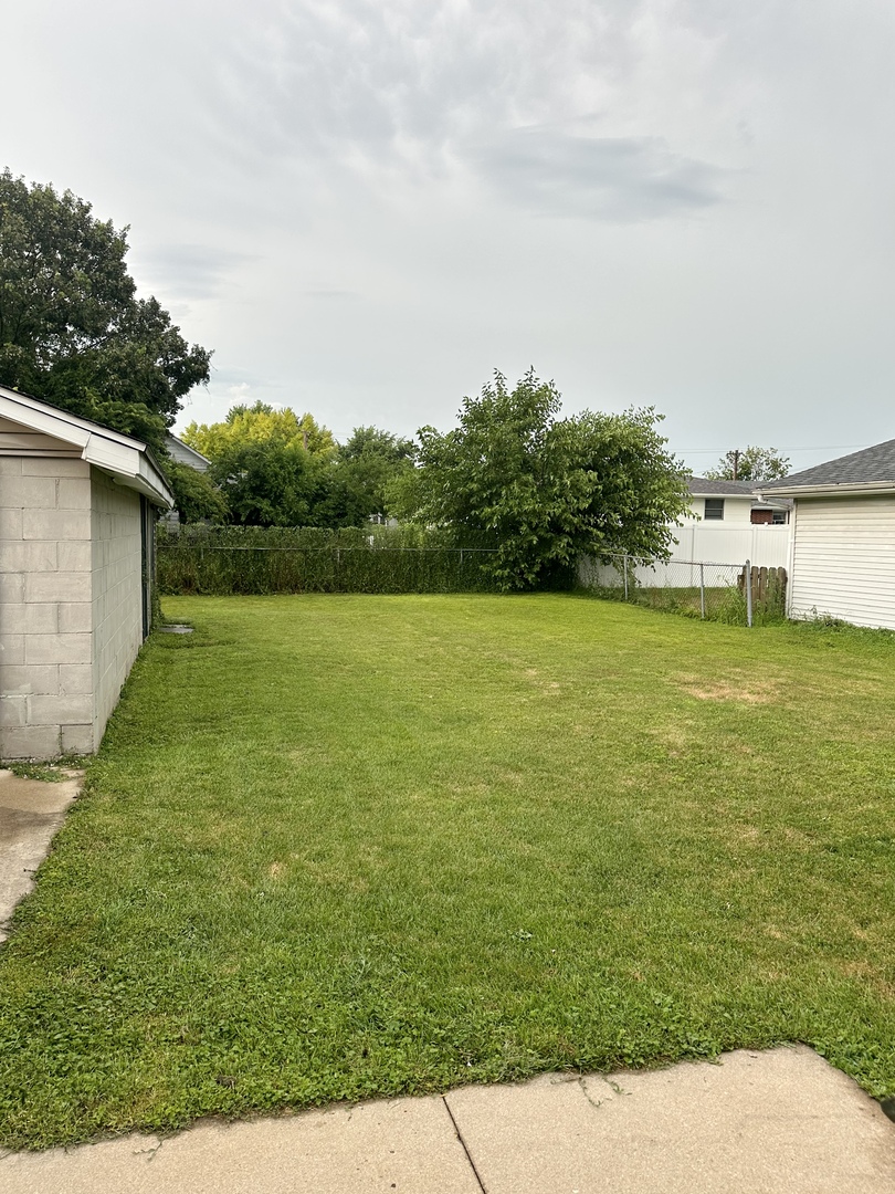 2021 7th Street Peru, IL 61354 - Photo 12 of 18 a view of a lake with a big yard