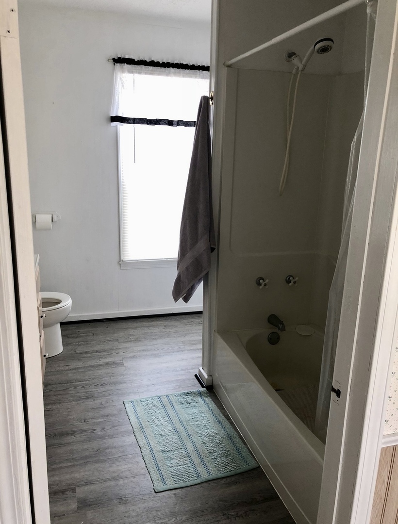 2021 7th Street Peru, IL 61354 - Photo 17 of 18 a bathroom with a tub a sink and a shower