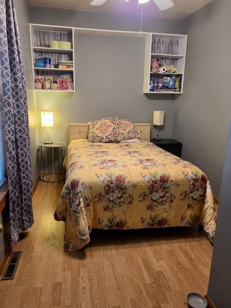 2021 7th Street Peru, IL 61354 - Photo 6 of 18 a bedroom with a bed and wall painting on the wall