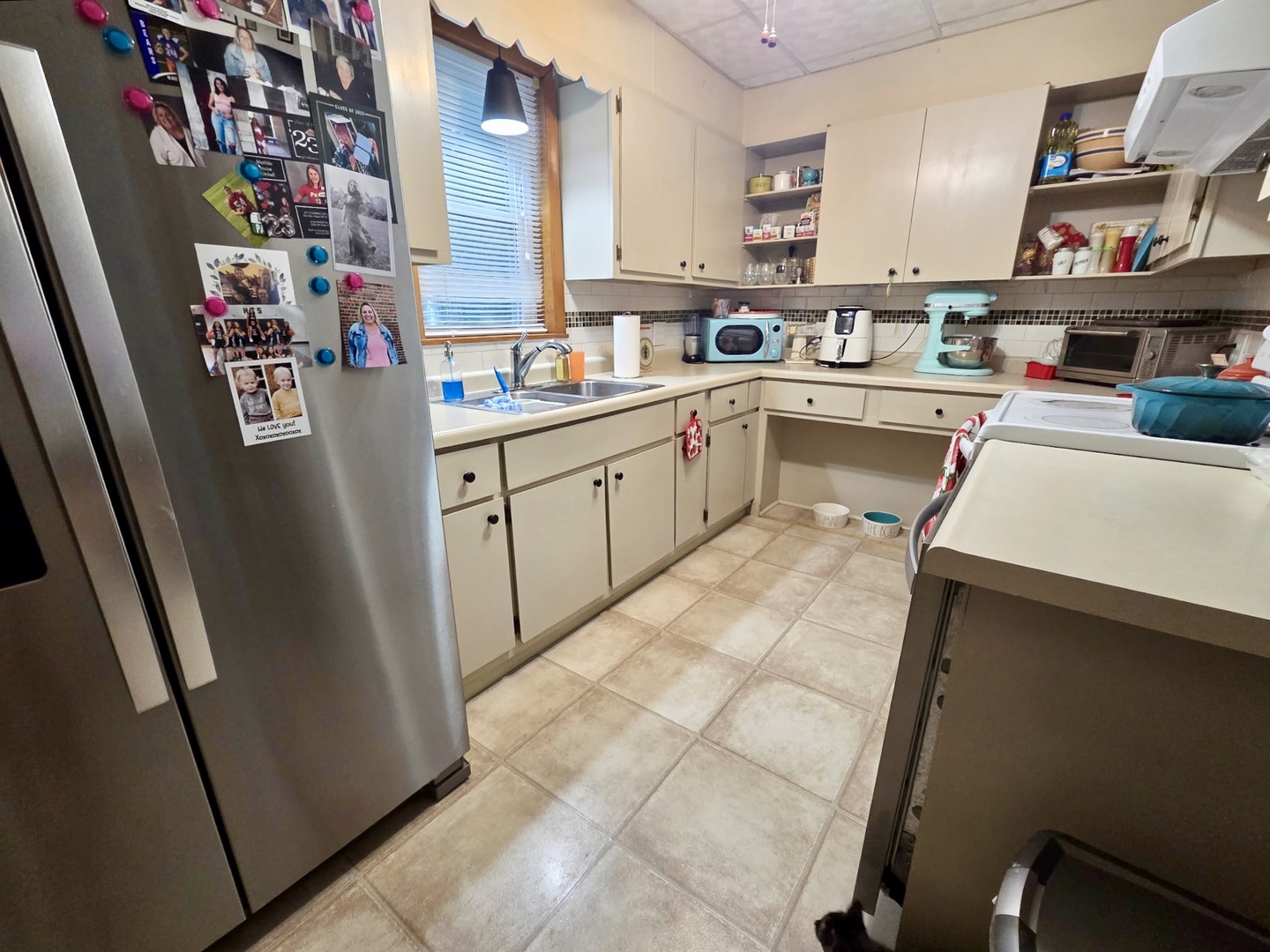 2021 7th Street Peru, IL 61354 - Photo 7 of 18 a kitchen with refrigerator and cabinets