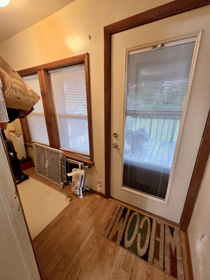 2021 7th Street Peru, IL 61354 - Photo 10 of 18 a room with gym equipment and a large window