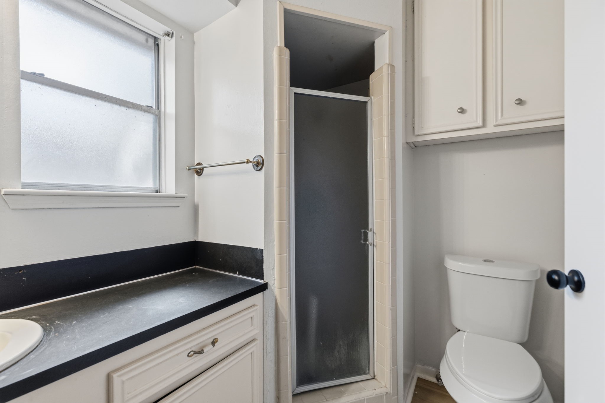 9618 Rannock Way Spring, TX 77379 - Photo 16 of 24 a bathroom with a toilet sink and vanity