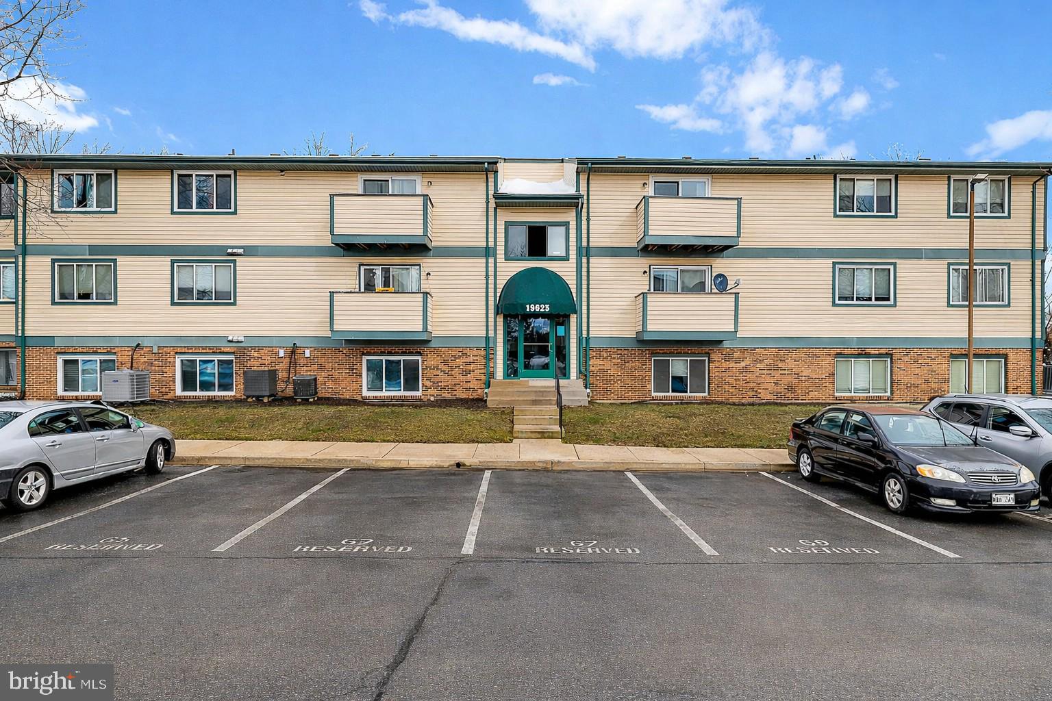 19625 Gunners Branch Road, Unit 932 Germantown, MD 20876 - Photo 1 of 21 a car parked in front of a building