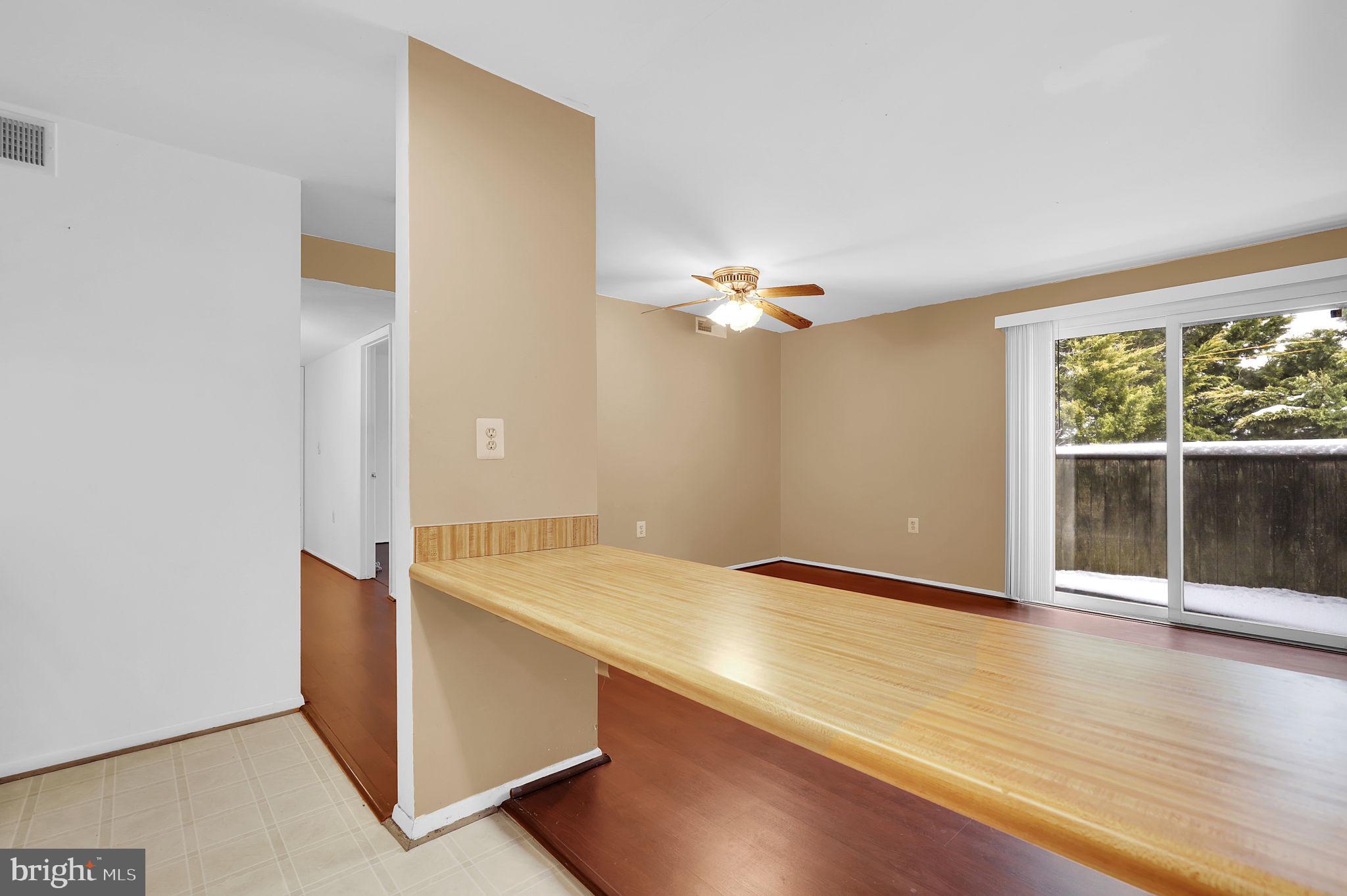 19625 Gunners Branch Road, Unit 932 Germantown, MD 20876 - Photo 9 of 21 a view of an empty room with wooden floor