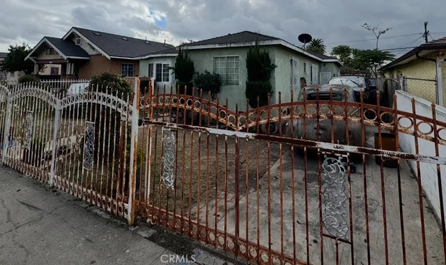 a view of street along with house and trees