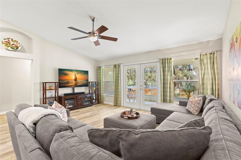 734 Berry Bramble Drive Brandon, FL 33510 - Photo 17 of 49 a living room with furniture and a flat screen tv