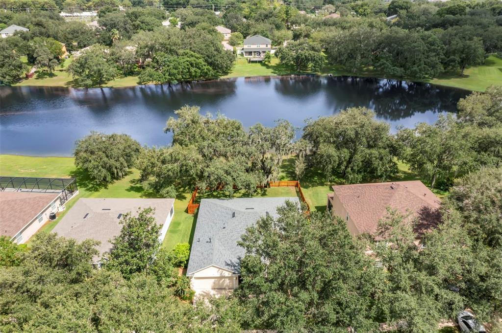 734 Berry Bramble Drive Brandon, FL 33510 - Photo 2 of 49 an aerial view of residential houses with outdoor space and lake view