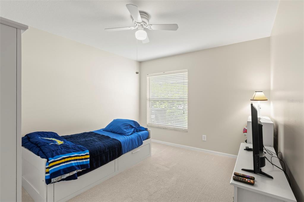 734 Berry Bramble Drive Brandon, FL 33510 - Photo 34 of 49 a living room with furniture a ceiling fan and a window
