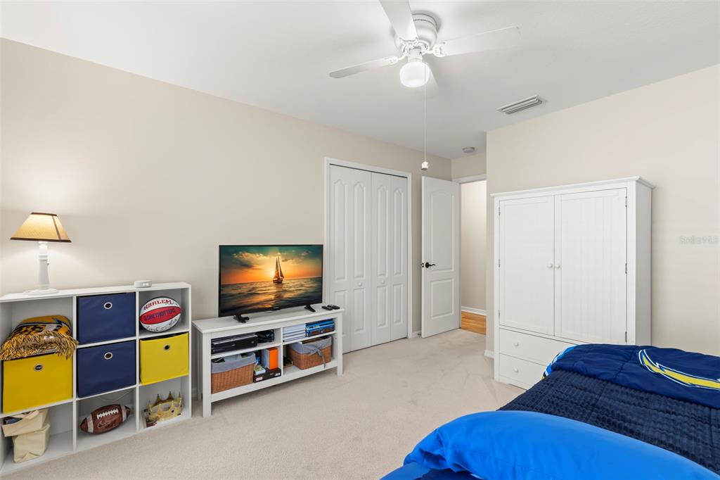 734 Berry Bramble Drive Brandon, FL 33510 - Photo 35 of 49 a living room with furniture and a flat screen tv