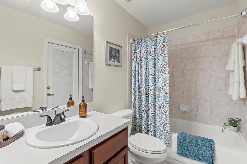 734 Berry Bramble Drive Brandon, FL 33510 - Photo 37 of 49 a bathroom with a sink toilet a mirror and shower