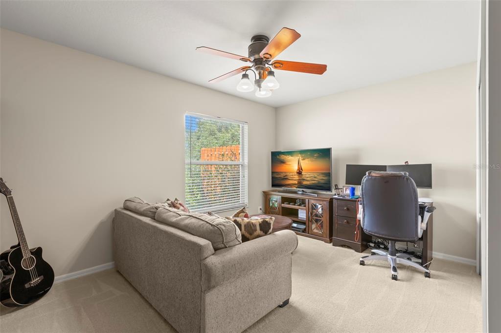 734 Berry Bramble Drive Brandon, FL 33510 - Photo 38 of 49 a living room with furniture and a flat screen tv